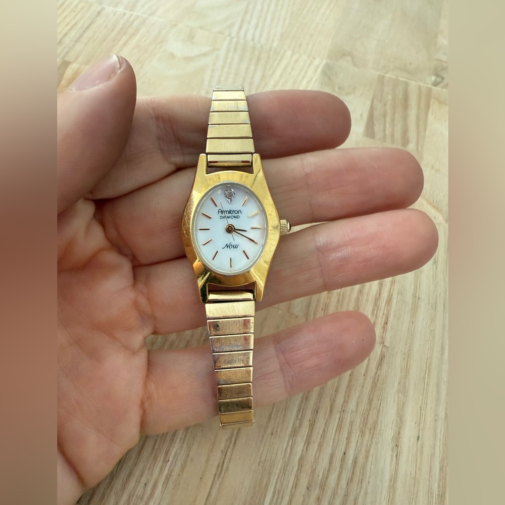 Armitron ladies diamond now oval gold tone watch NEW BATTERY